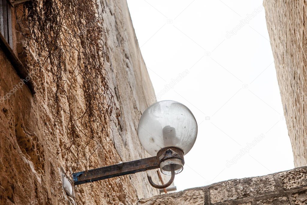 lamp on street of stone old city Jaffa in Tel Aviv