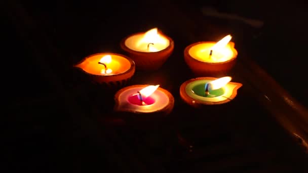 Beautiful Colorful Candles Clay Candleholders Lightning — Stock Video