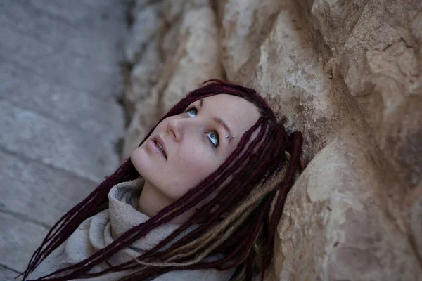 Portrait of a  young woman with pink dreadlocks in Old Jerusalem