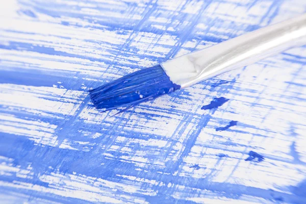 Blue painted background with brush — Stock Photo, Image