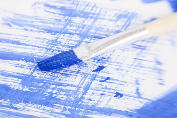 Blue painted background with brush — Stock Photo, Image