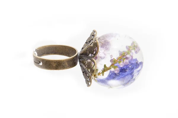 Ring in resin with flower — Stock Photo, Image