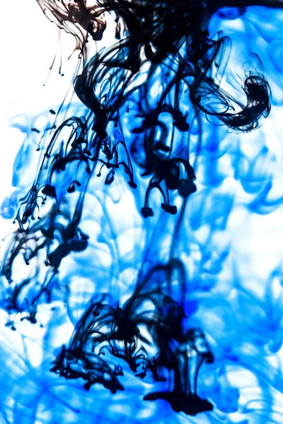 Blue and black liquid in water — Stock Photo, Image