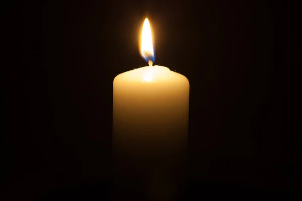 Candle on the black background — Stock Photo, Image