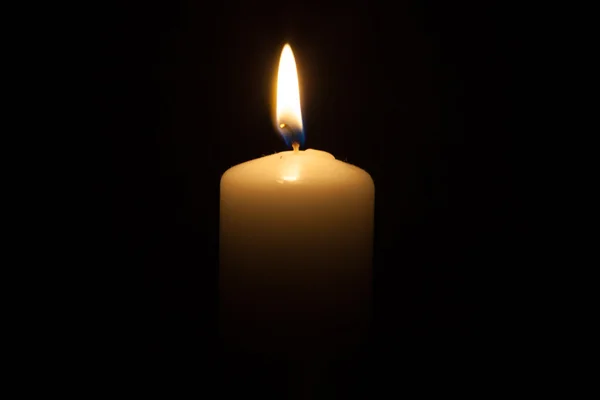 Candle on the black background — Stock Photo, Image