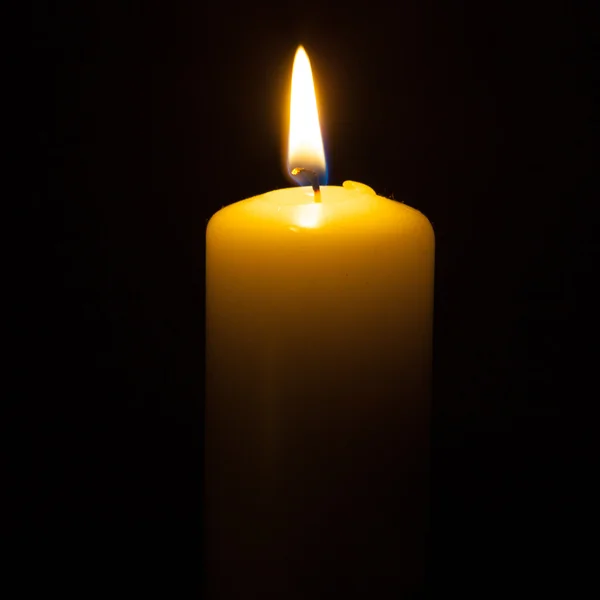 Candle on the black background — Stock Photo, Image