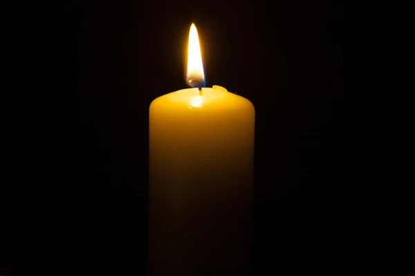 Candle on the black background — Stock Photo, Image