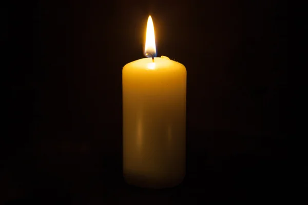 Candle on the black background — Stock Photo, Image