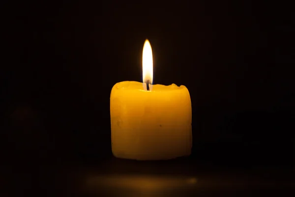 Candle on the black background — Stock Photo, Image