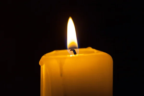 Candle on the black background — Stock Photo, Image