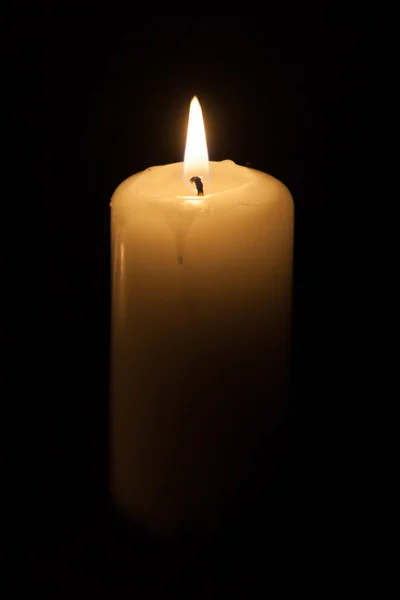 Candle on the black background — Stock Photo, Image