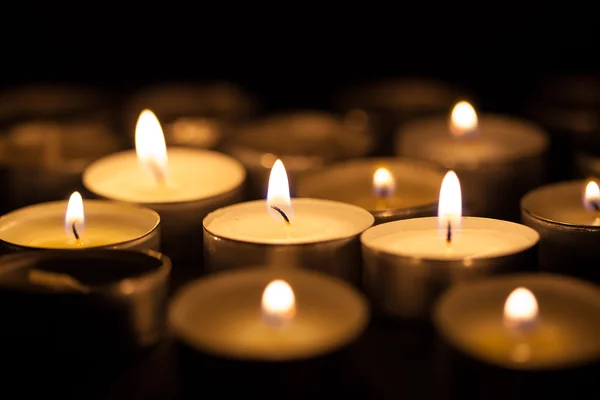 Candles cutting through the darkness — Stock Photo, Image