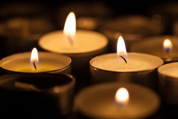 Candles cutting through the darkness — Stock Photo, Image