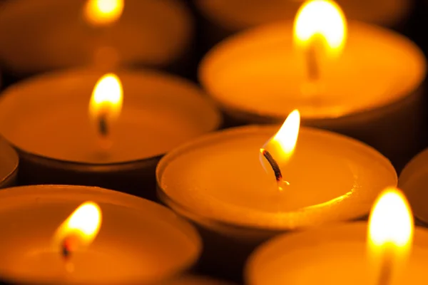 Candles cutting through the darkness — Stock Photo, Image