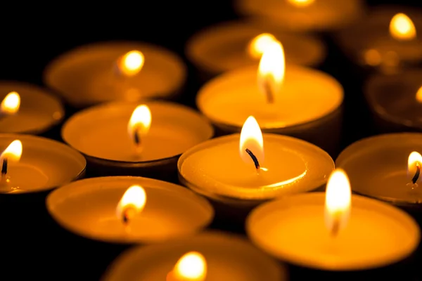 Candles cutting through the darkness — Stock Photo, Image