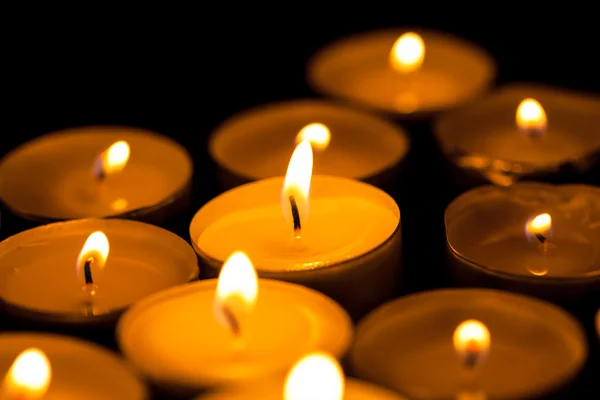 Candles cutting through the darkness — Stock Photo, Image