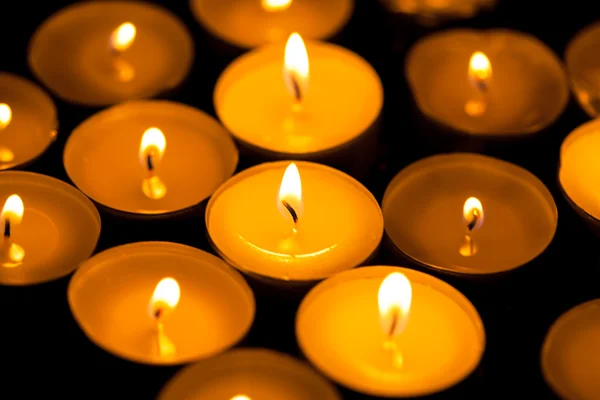 Candles cutting through the darkness — Stock Photo, Image