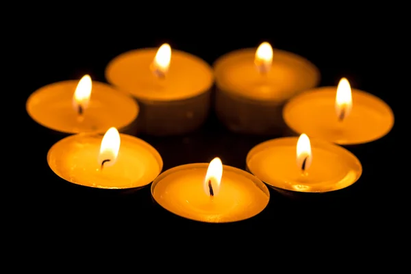 Candles cutting through the darkness — Stock Photo, Image