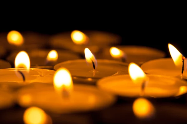 Candles cutting through the darkness — Stock Photo, Image