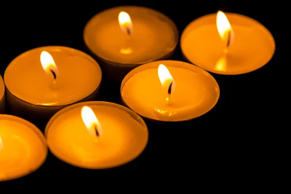 Candles cutting through the darkness — Stock Photo, Image