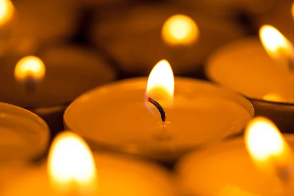 Candles cutting through the darkness — Stock Photo, Image