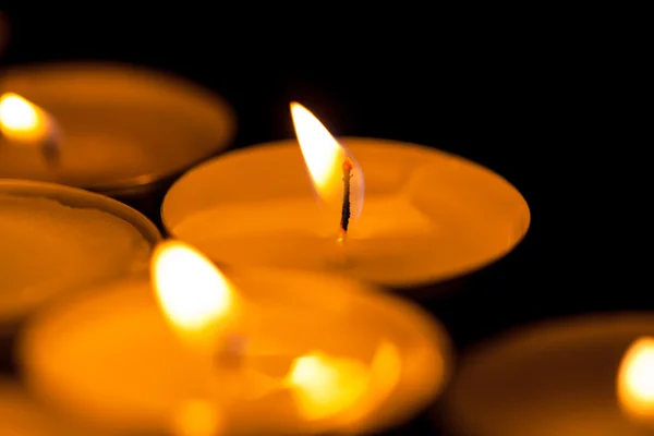 Candles cutting through the darkness — Stock Photo, Image