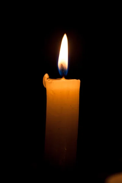 Candle on the black background — Stock Photo, Image