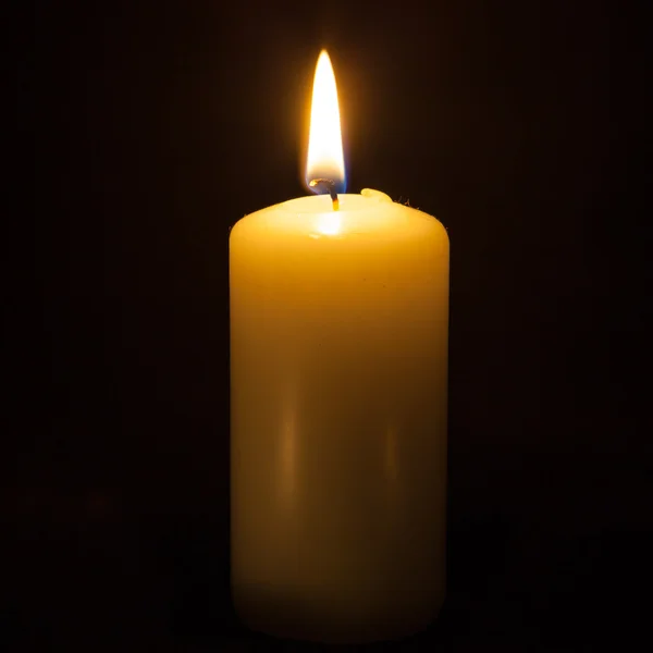 Candle on the black background — Stock Photo, Image