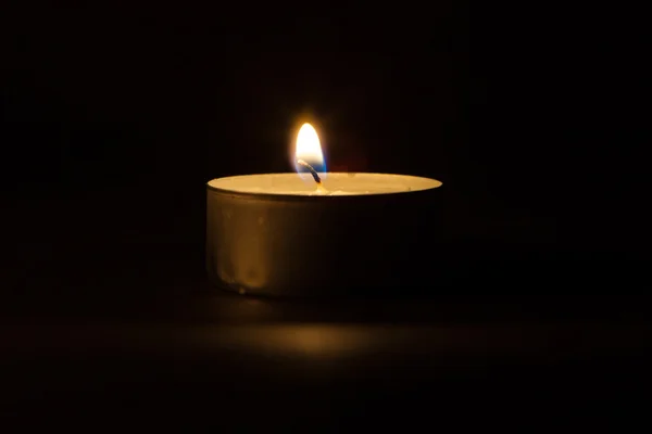 Candle on the black background Stock Picture