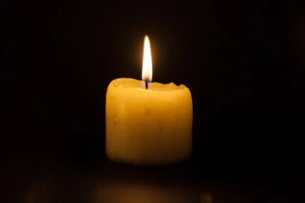 Candle on the black background — Stock Photo, Image