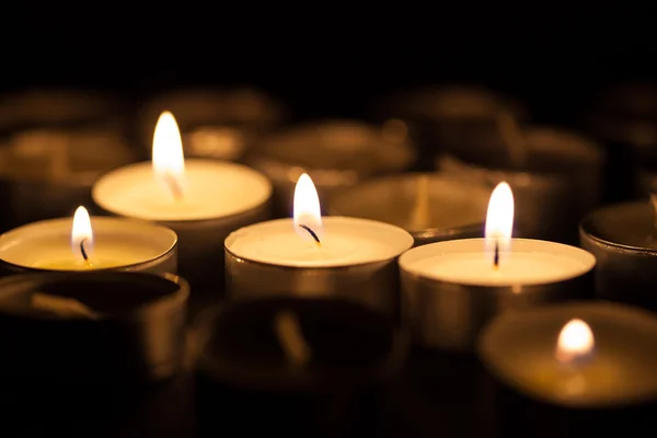 Candles cutting through the darkness — Stock Photo, Image