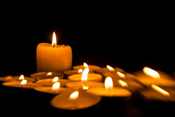 Candles cutting through the darkness — Stock Photo, Image