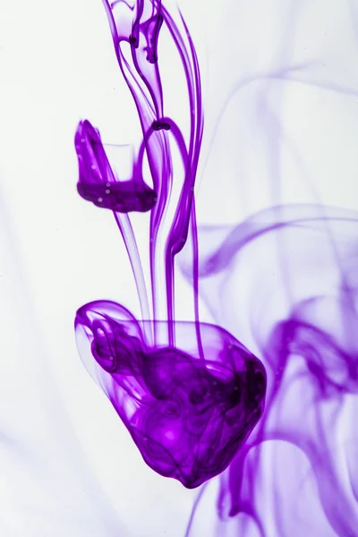 Violet liquid in water — Stock Photo, Image