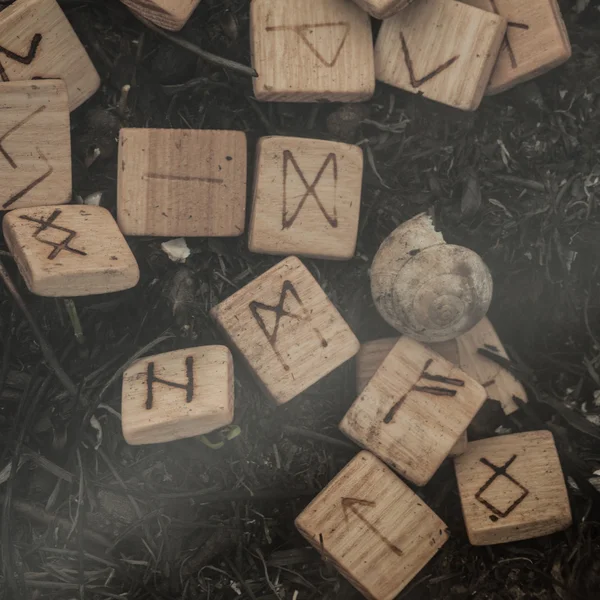 Wooden runes on the ground — Stock Photo, Image