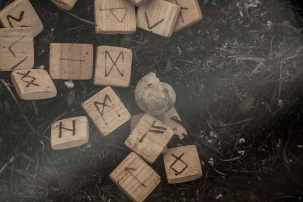 Wooden runes on the ground — Stock Photo, Image