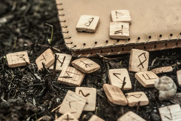 Wooden runes on the ground — Stock Photo, Image