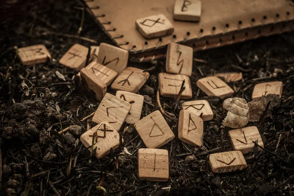 Wooden runes on the ground — Stock Photo, Image