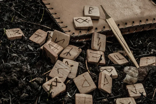 Wooden runes on the ground — Stock Photo, Image