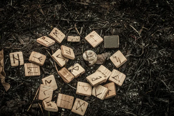 Wooden runes on the ground — Stock Photo, Image