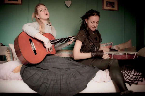 Two beautiful woman with  tambourine and guitar — Stock Photo, Image