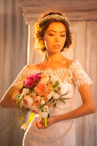Young attractive bride with flowers — Stock Photo, Image