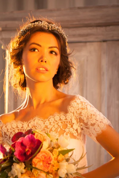 Young attractive bride with flowers — Stock Photo, Image