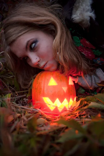 Halloween pumpkins on rocks in a forest at night — Stock Photo, Image