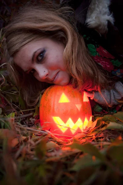 Halloween pumpkins on rocks in a forest at night — Stock Photo, Image