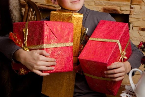 Portrait of adorable boy with giftboxes — Stock Photo, Image