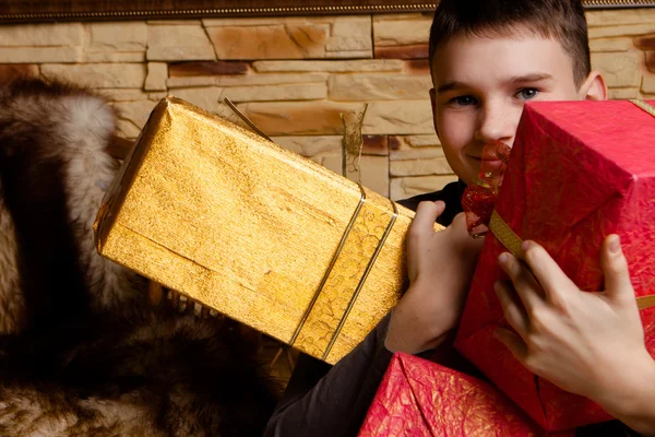 Portrait of adorable boy with giftboxes — Stock Photo, Image