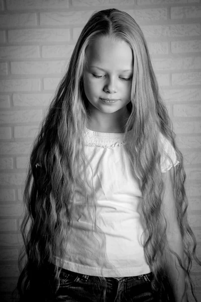 Beautiful little girl with long blonde hair — Stock Photo, Image