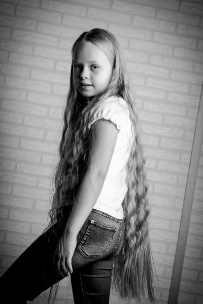 Beautiful little girl with long blonde hair — Stock Photo, Image