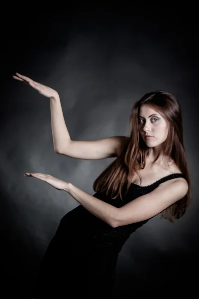 Beautiful fashionable woman in black dress — Stock Photo, Image