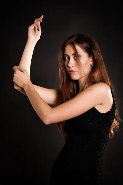 Beautiful fashionable woman in black dress — Stock Photo, Image